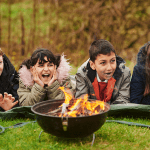 Primary school children enjoy a fire outdoors